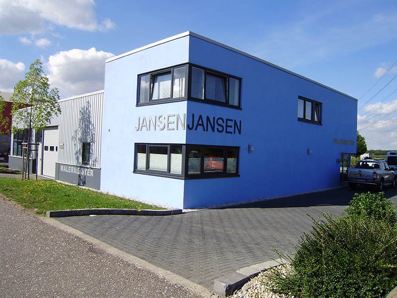 Blaues Betriebsgebäude mit der Aufschrift Jansen